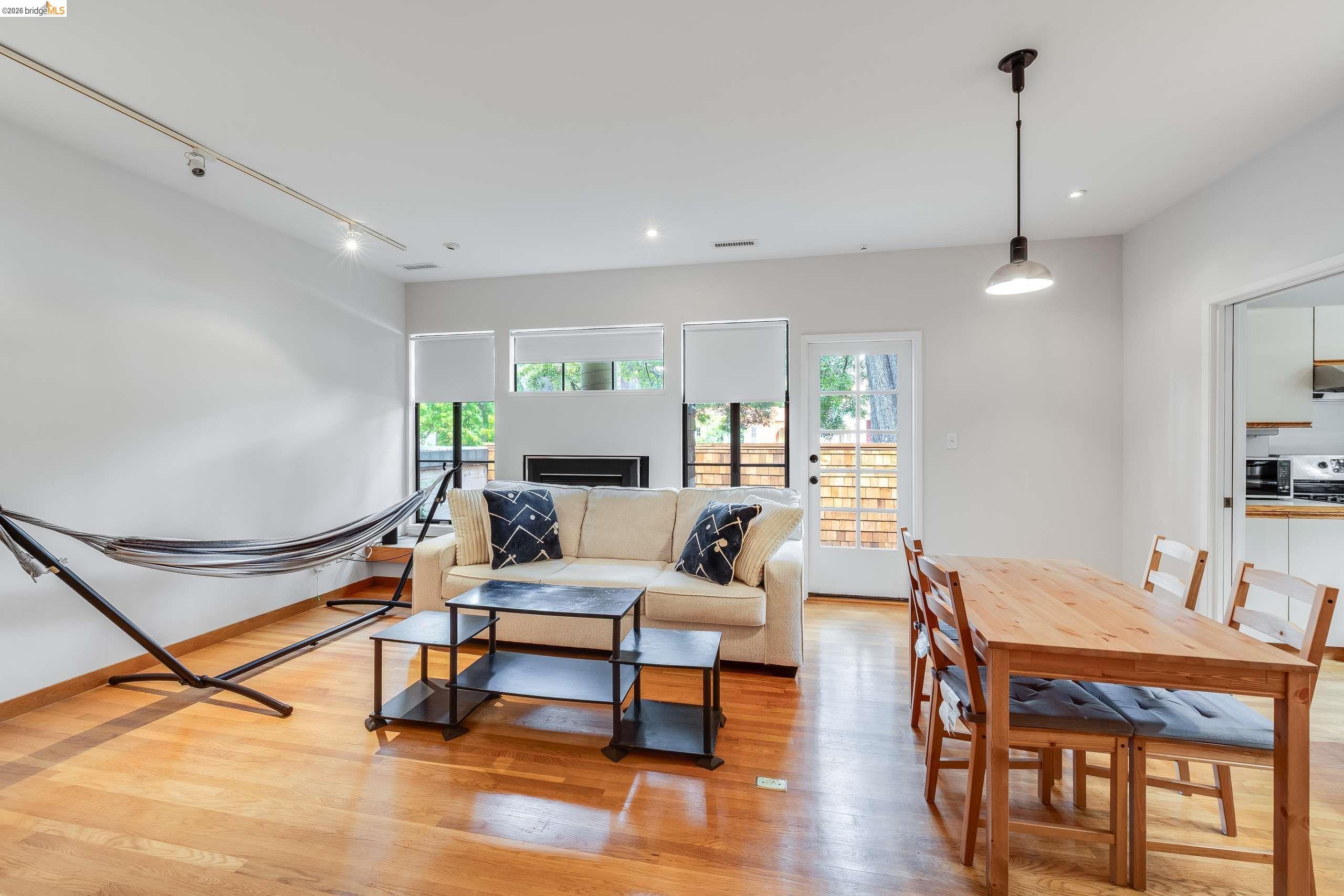 2316 Blake Street, Unit A Berkeley, CA 94704 - Photo 6 of 30 Living area featuring light wood-style flooring, track lighting, and healthy amount of natural light