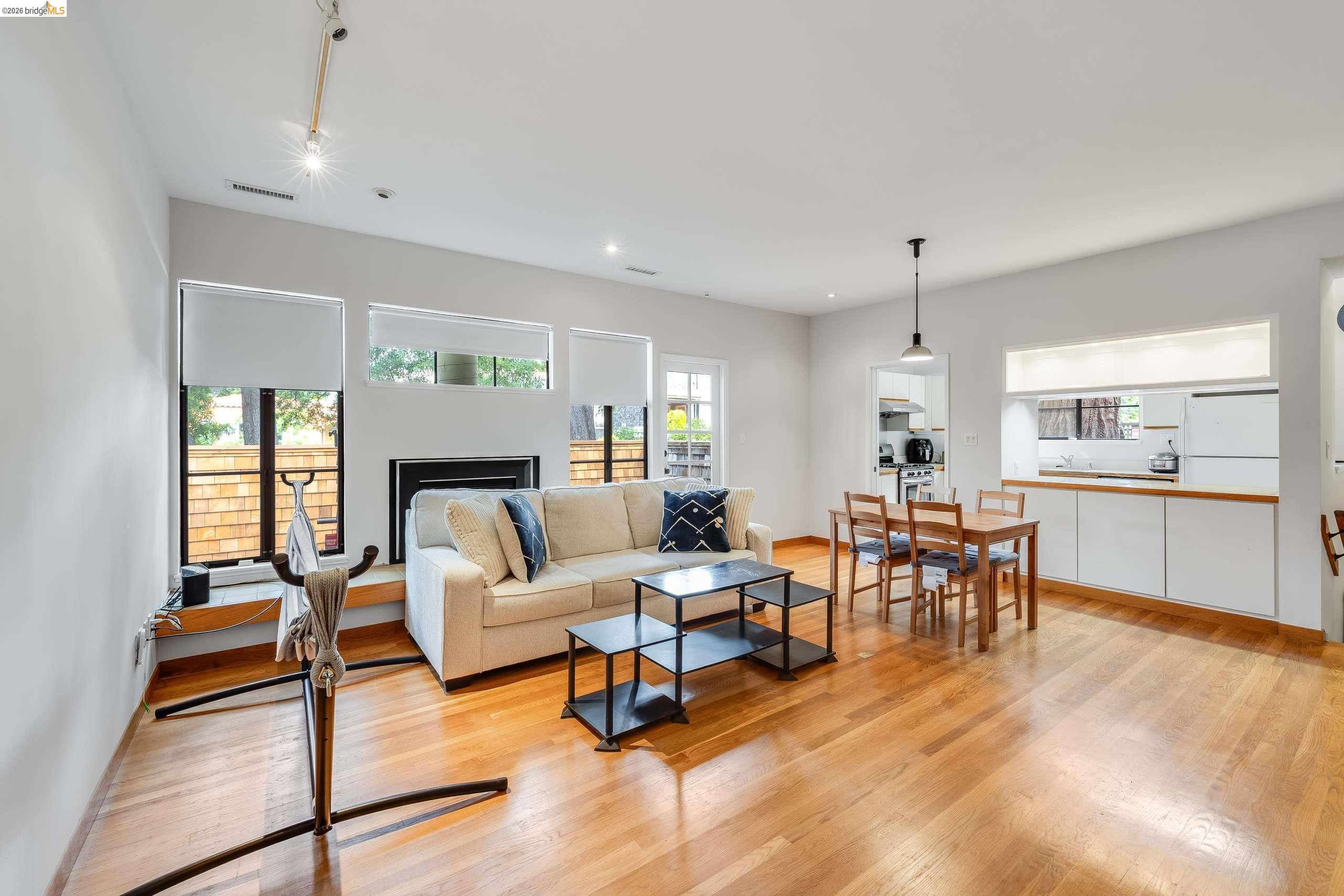 2316 Blake Street, Unit A Berkeley, CA 94704 - Photo 7 of 30 Living room featuring light wood finished floors, a fireplace, and recessed lighting