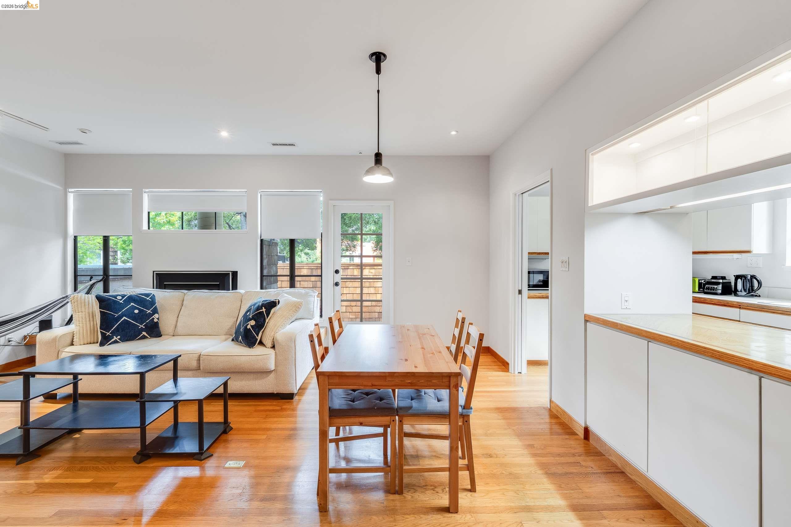 2316 Blake Street, Unit A Berkeley, CA 94704 - Photo 9 of 30 Dining area with light wood-style floors, recessed lighting, and a fireplace