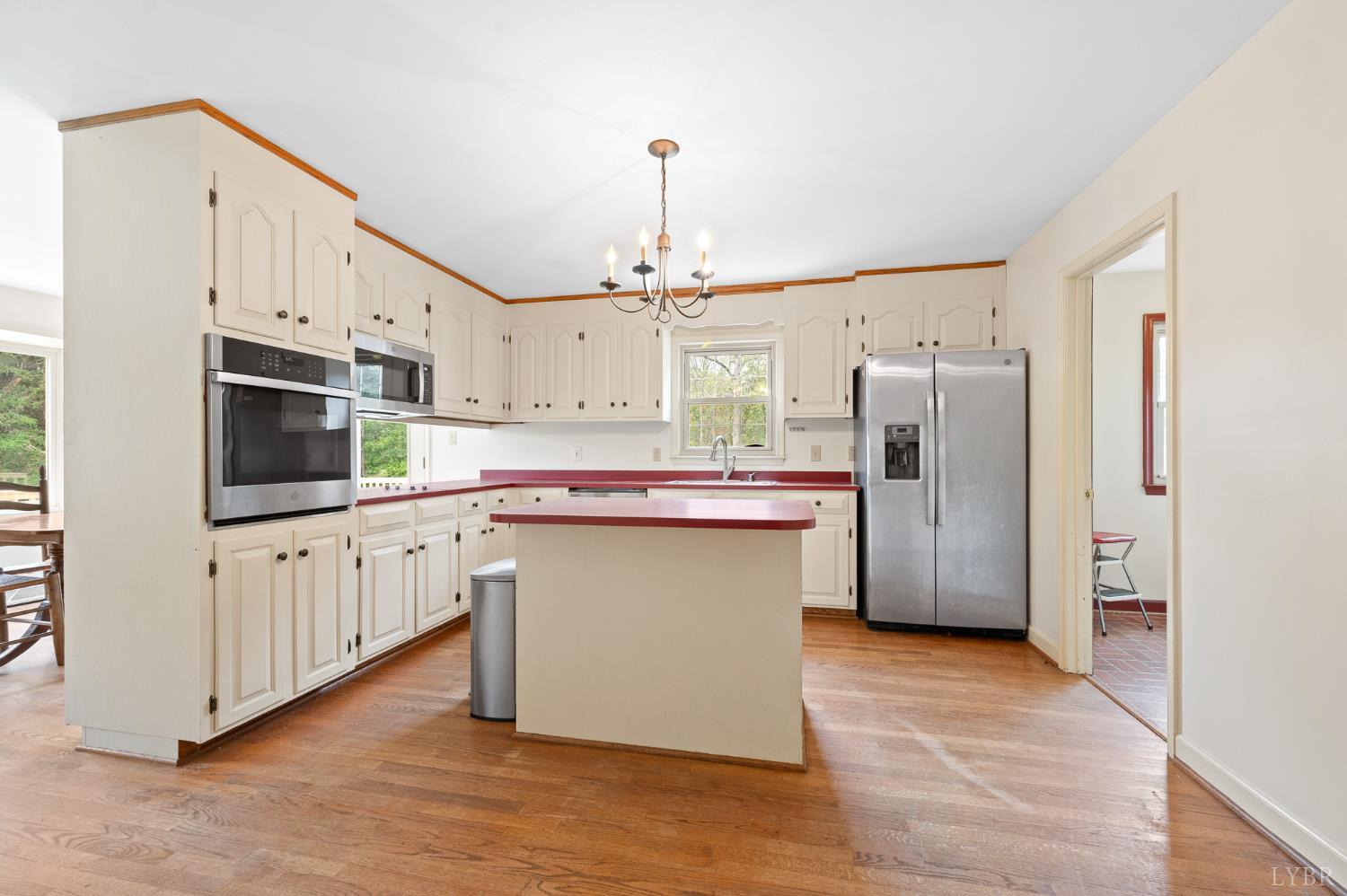 111 East Otter Ridge Drive Goode, VA 24556 - Photo 14 of 62 a kitchen with stainless steel appliances a refrigerator sink and cabinets