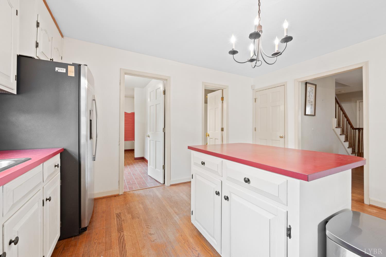 111 East Otter Ridge Drive Goode, VA 24556 - Photo 17 of 62 a spacious bathroom with a granite countertop sink and a refrigerator