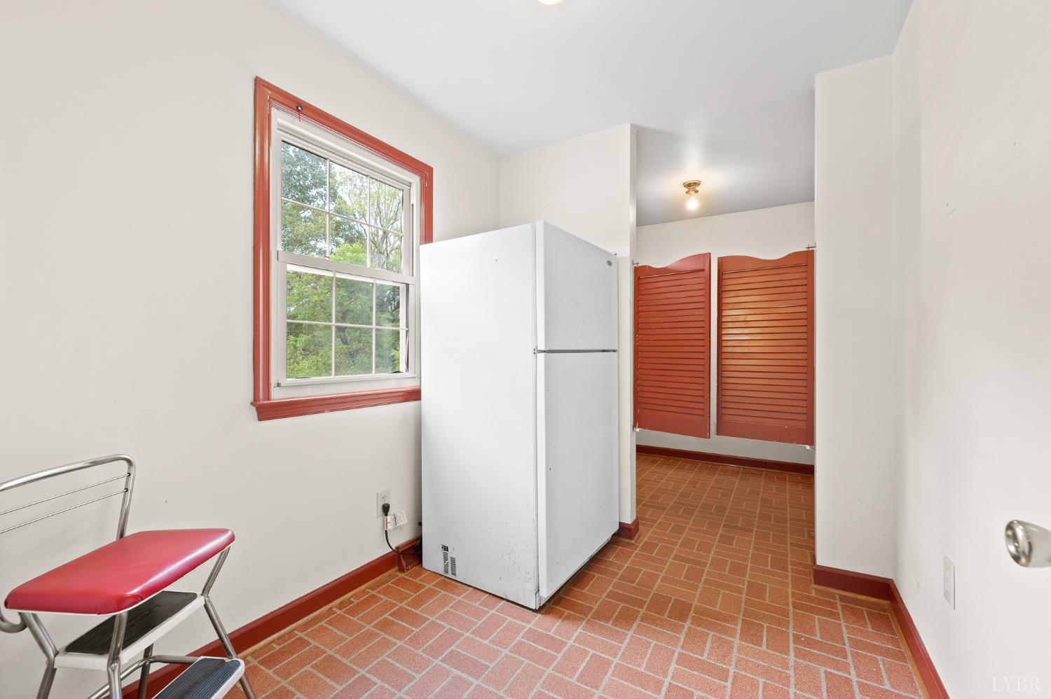 111 East Otter Ridge Drive Goode, VA 24556 - Photo 18 of 62 a view of a kitchen with refrigerator and a window