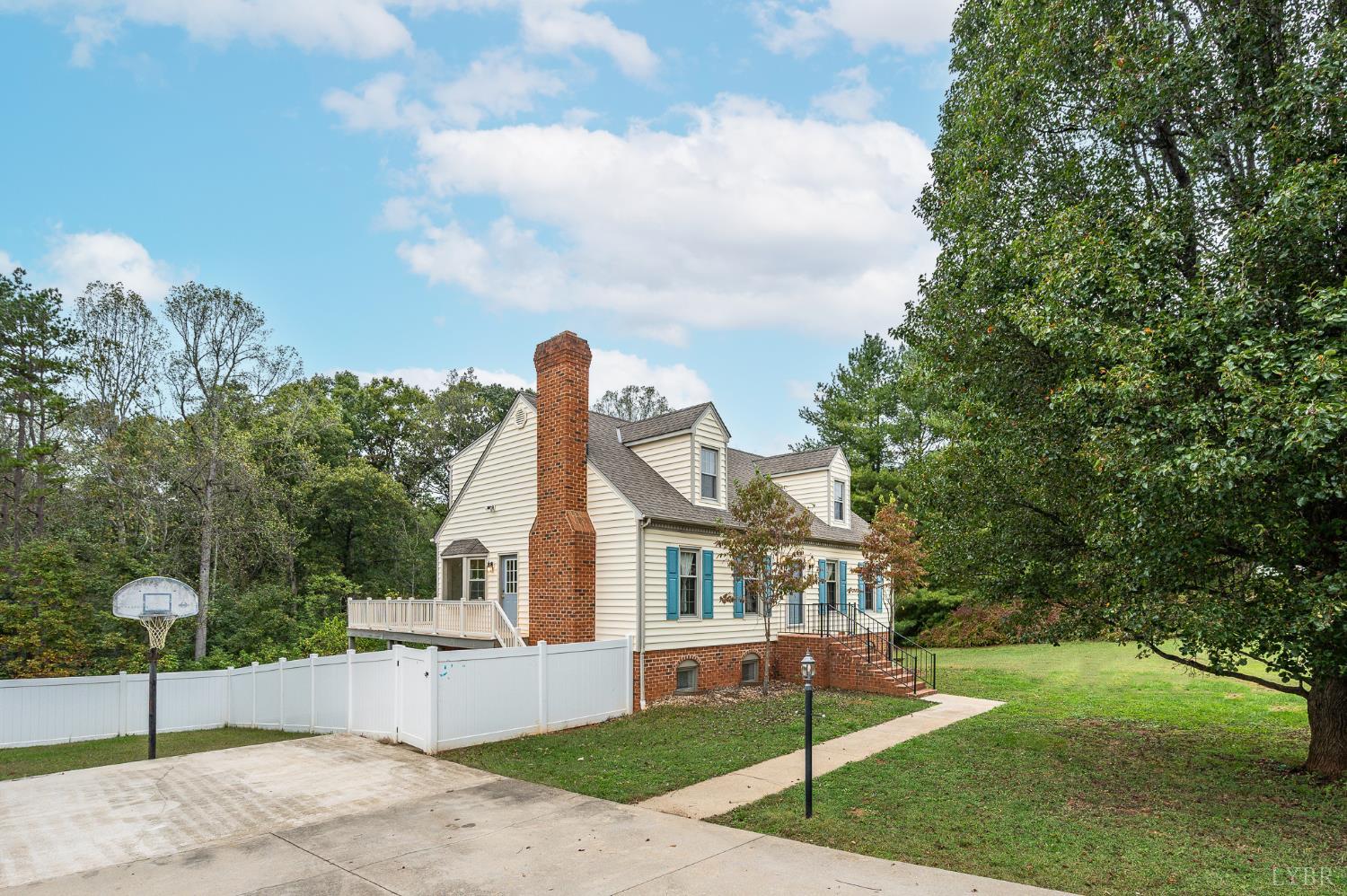 111 East Otter Ridge Drive Goode, VA 24556 - Photo 2 of 62 a front view of a house with a garden and yard