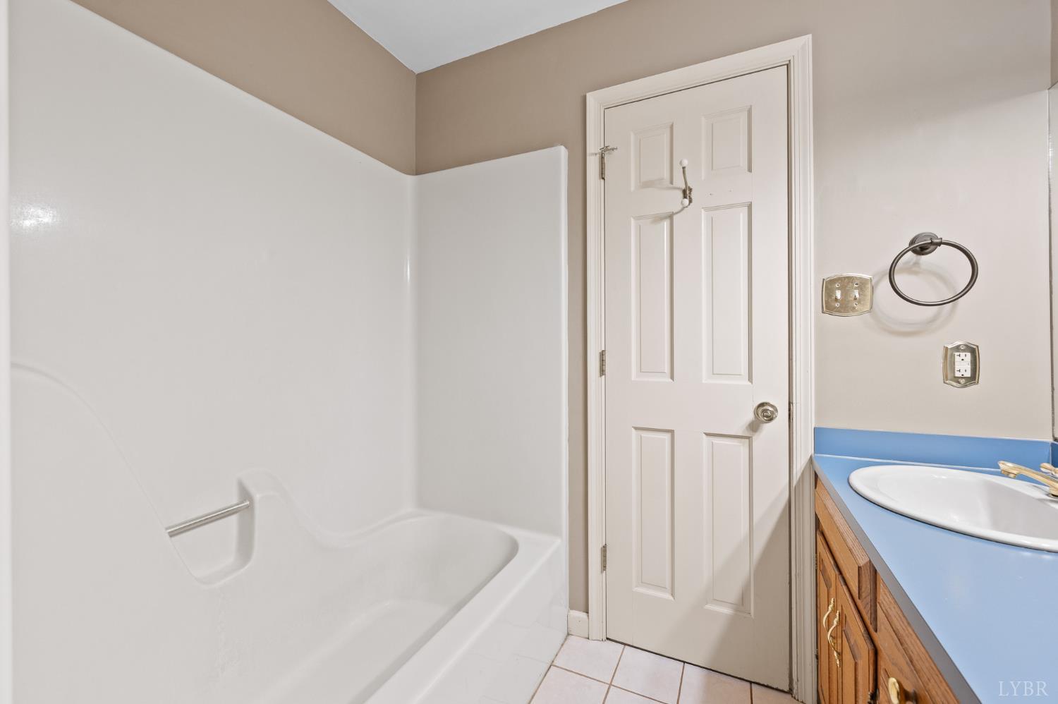 111 East Otter Ridge Drive Goode, VA 24556 - Photo 21 of 62 a bathroom with a granite countertop sink and a mirror