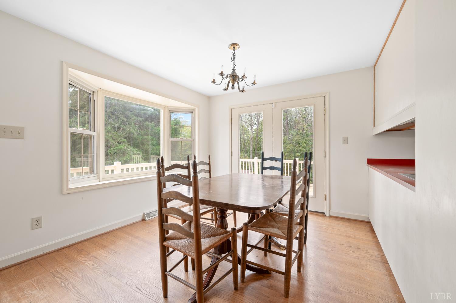 111 East Otter Ridge Drive Goode, VA 24556 - Photo 23 of 62 a dining room with furniture window wooden floor