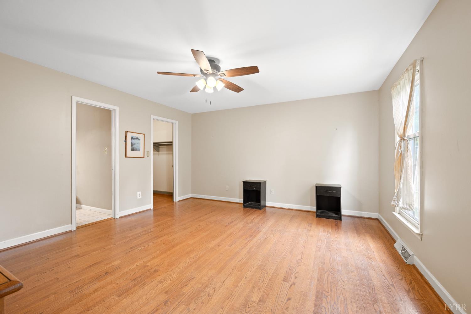 111 East Otter Ridge Drive Goode, VA 24556 - Photo 25 of 62 a view of an empty room with window and wooden floor