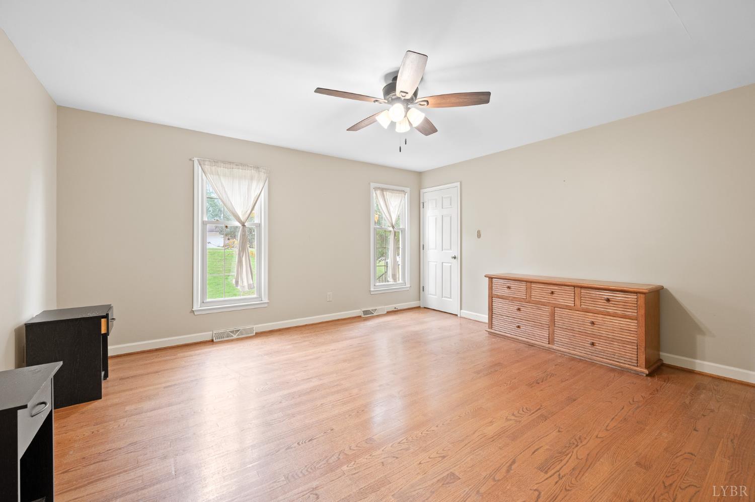111 East Otter Ridge Drive Goode, VA 24556 - Photo 26 of 62 a view of an empty room with window and wooden floor