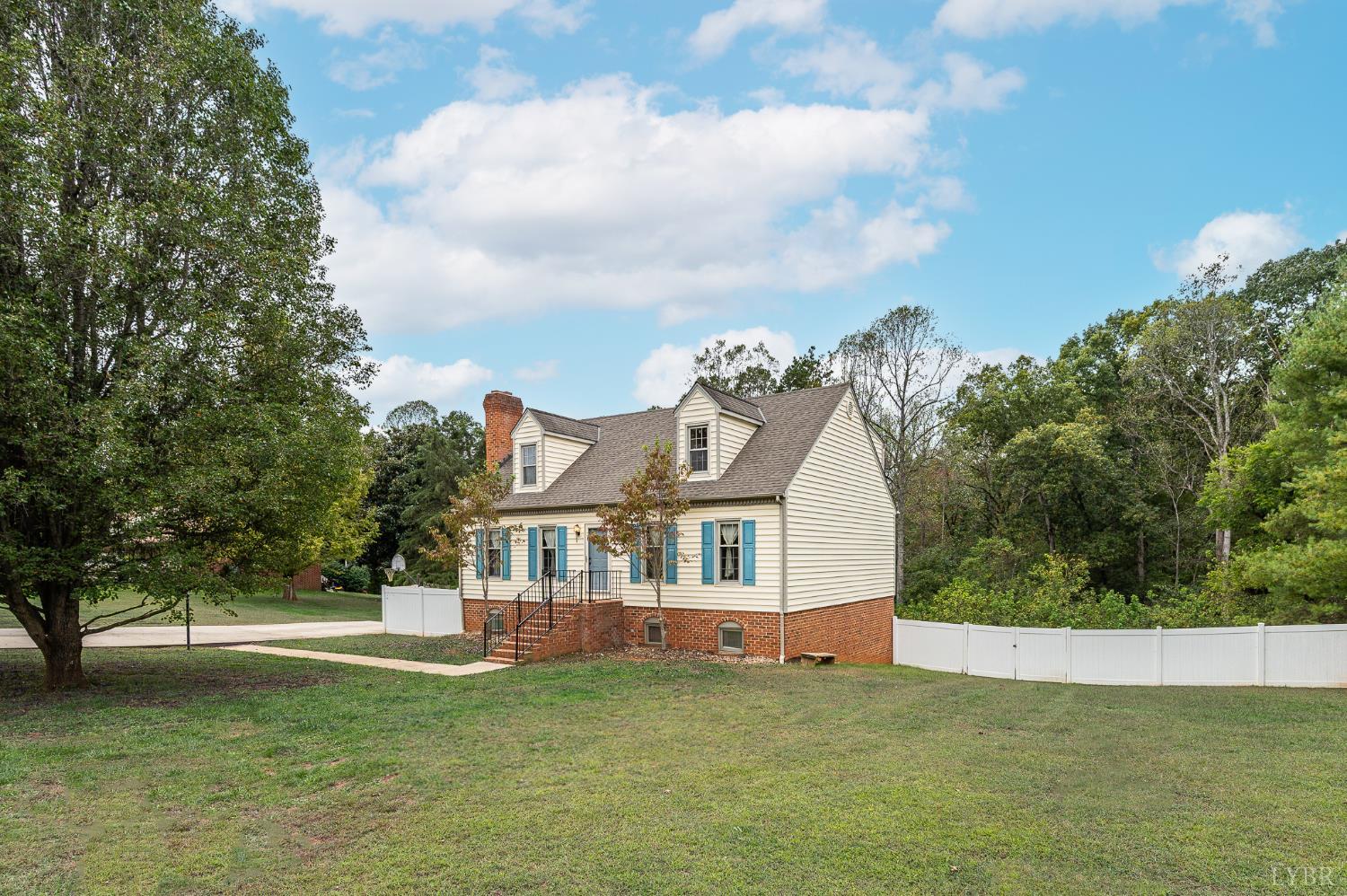 111 East Otter Ridge Drive Goode, VA 24556 - Photo 3 of 62 a front view of a house with a garden