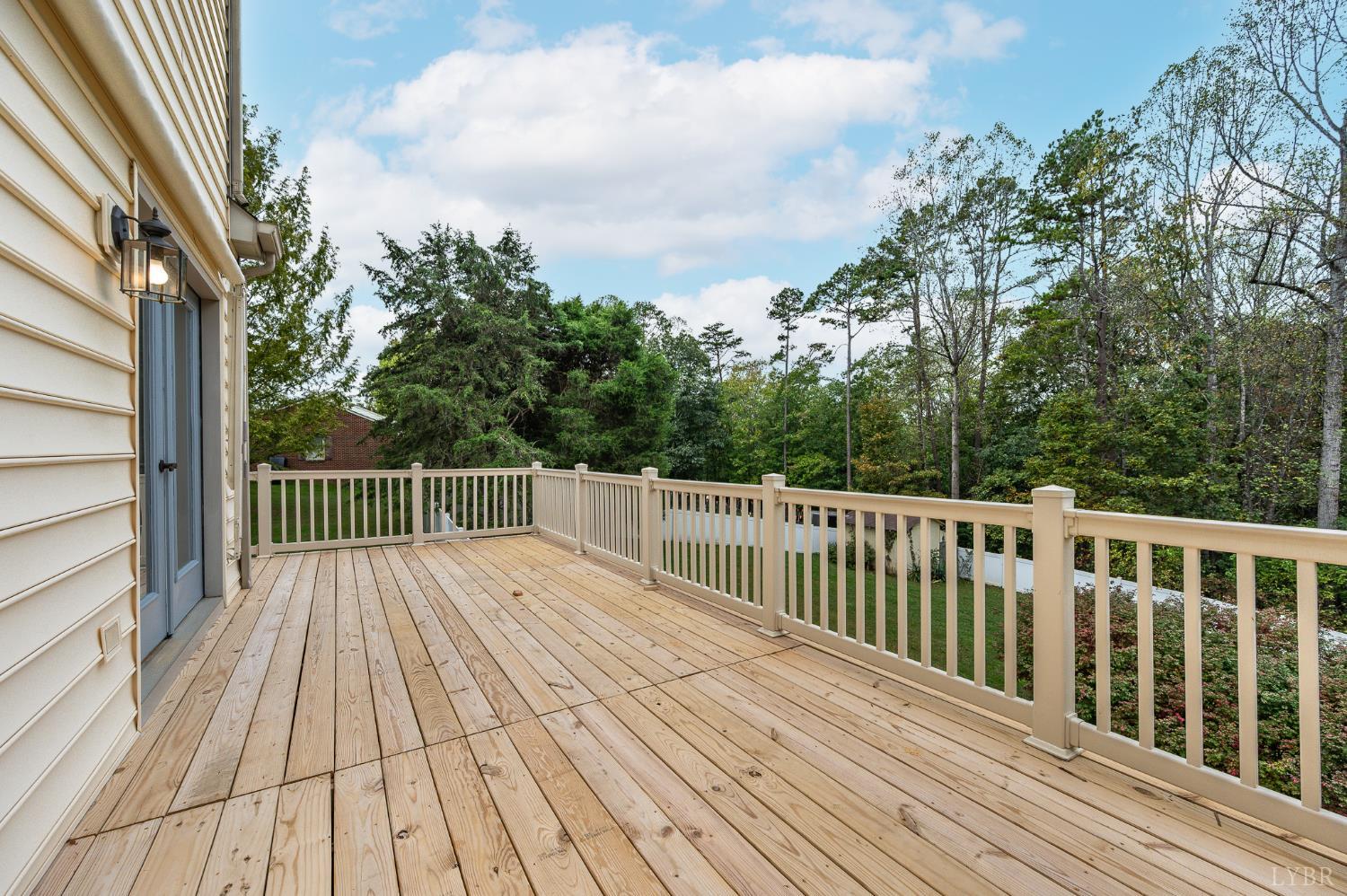 111 East Otter Ridge Drive Goode, VA 24556 - Photo 46 of 62 a balcony with wooden floor and fence