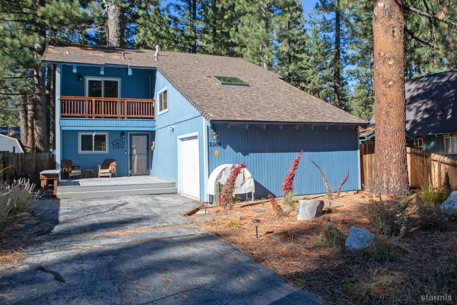 2569 Alma Avenue South Lake Tahoe, CA 96150 - Photo 1 of 35 a view of a house with backyard