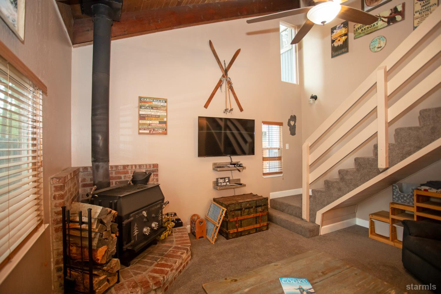 2569 Alma Avenue South Lake Tahoe, CA 96150 - Photo 11 of 35 a living room with furniture and a flat screen tv
