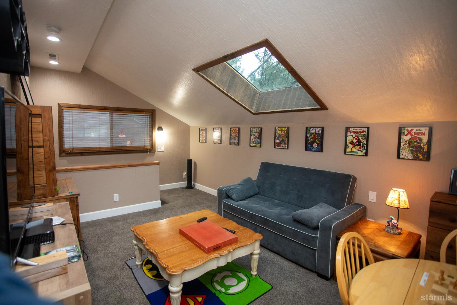 2569 Alma Avenue South Lake Tahoe, CA 96150 - Photo 19 of 35 a living room with furniture and a flat screen tv