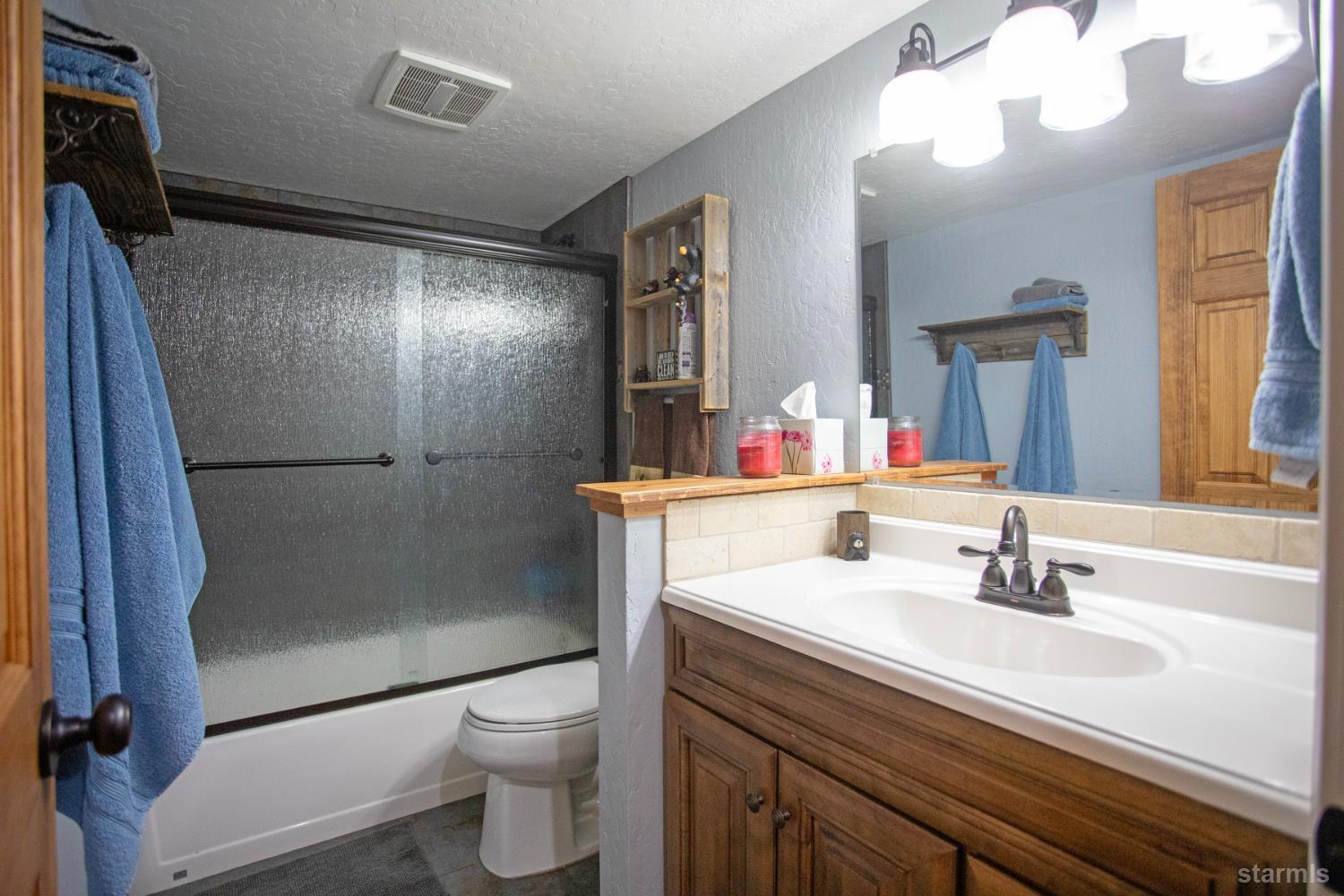 2569 Alma Avenue South Lake Tahoe, CA 96150 - Photo 21 of 35 a bathroom with a sink a toilet and shower