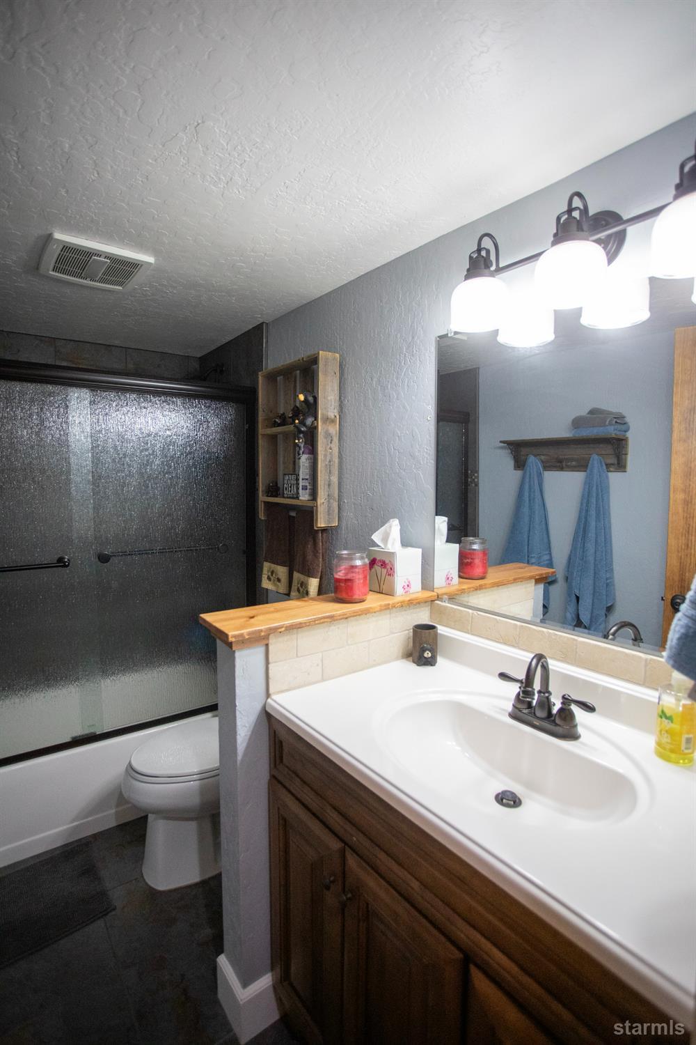 2569 Alma Avenue South Lake Tahoe, CA 96150 - Photo 22 of 35 a bathroom with a sink and a mirror