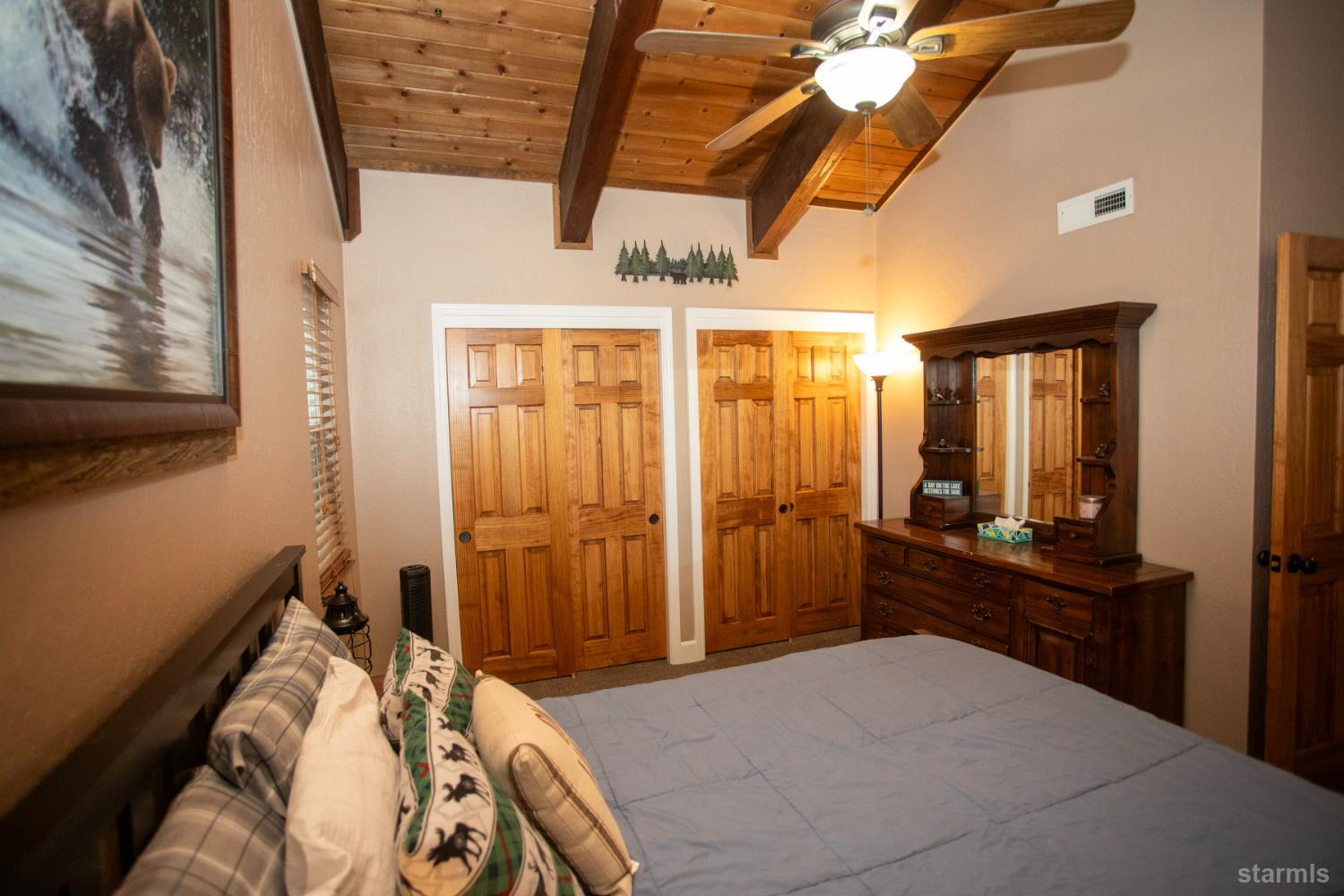 2569 Alma Avenue South Lake Tahoe, CA 96150 - Photo 24 of 35 a bedroom with a bed and a walk in closet