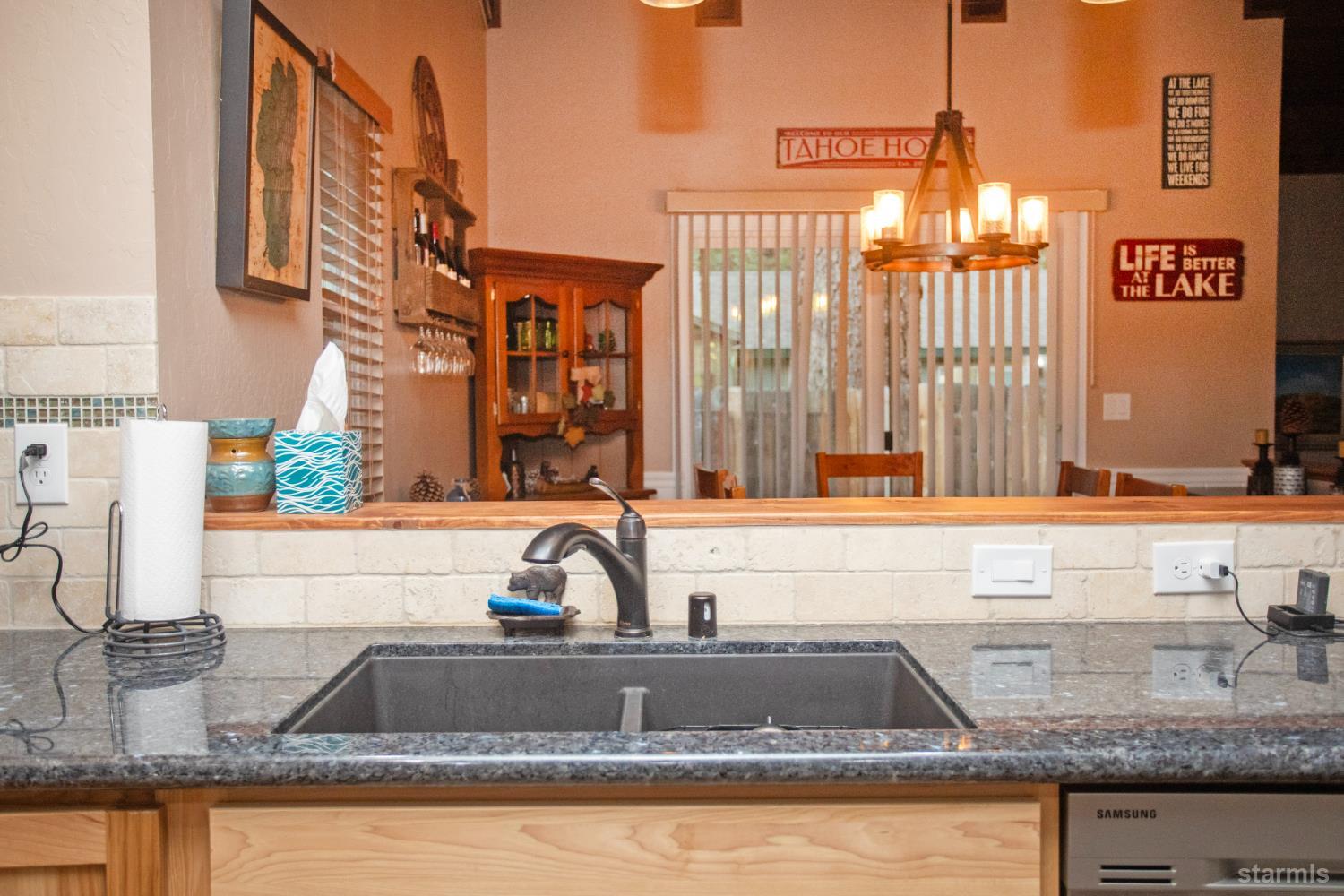 2569 Alma Avenue South Lake Tahoe, CA 96150 - Photo 3 of 35 a kitchen with granite countertop a sink and a window