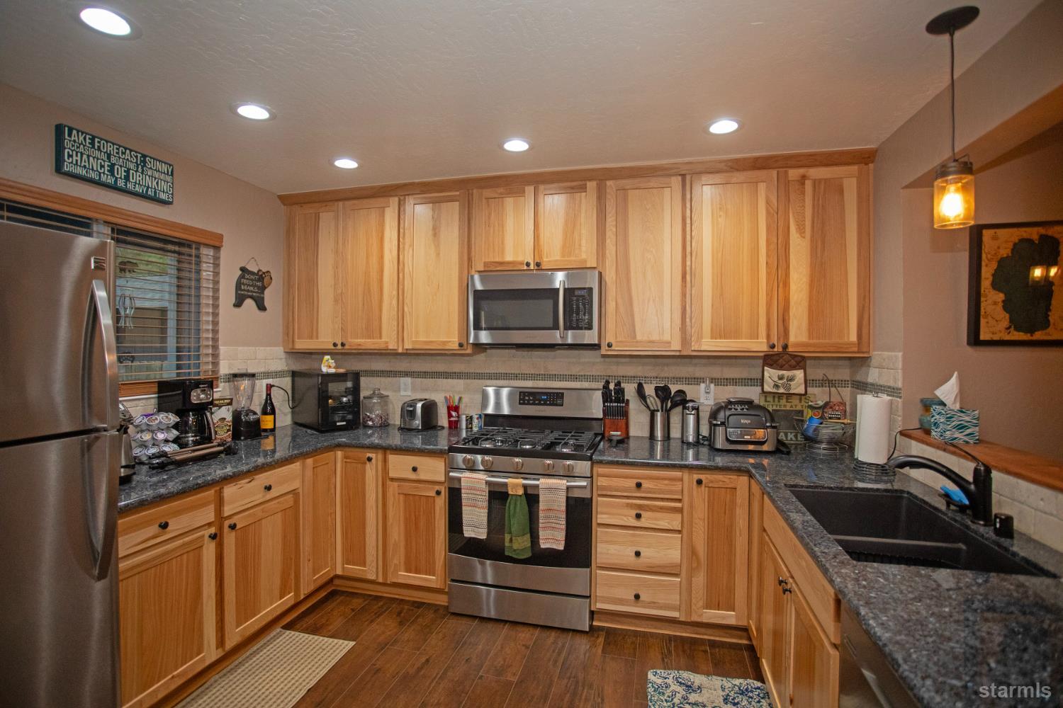 2569 Alma Avenue South Lake Tahoe, CA 96150 - Photo 4 of 35 a kitchen with a sink stove and microwave