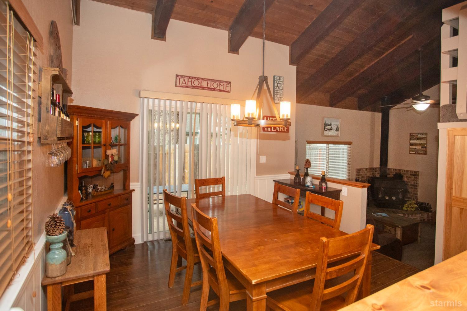 2569 Alma Avenue South Lake Tahoe, CA 96150 - Photo 6 of 35 a dining room with furniture and wooden floor