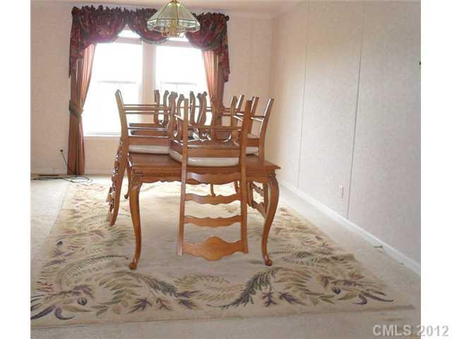 872 Tower Road Vale, NC 28168 - Photo 5 of 6 a view of a dining room with furniture and a floor to ceiling window