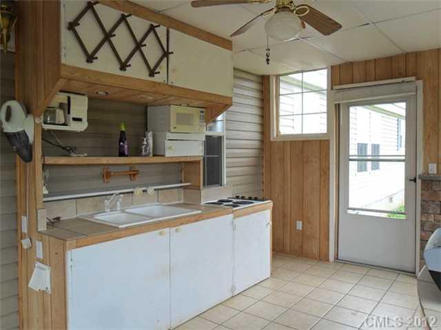 872 Tower Road Vale, NC 28168 - Photo 6 of 6 a kitchen with a sink a refrigerator and cabinets