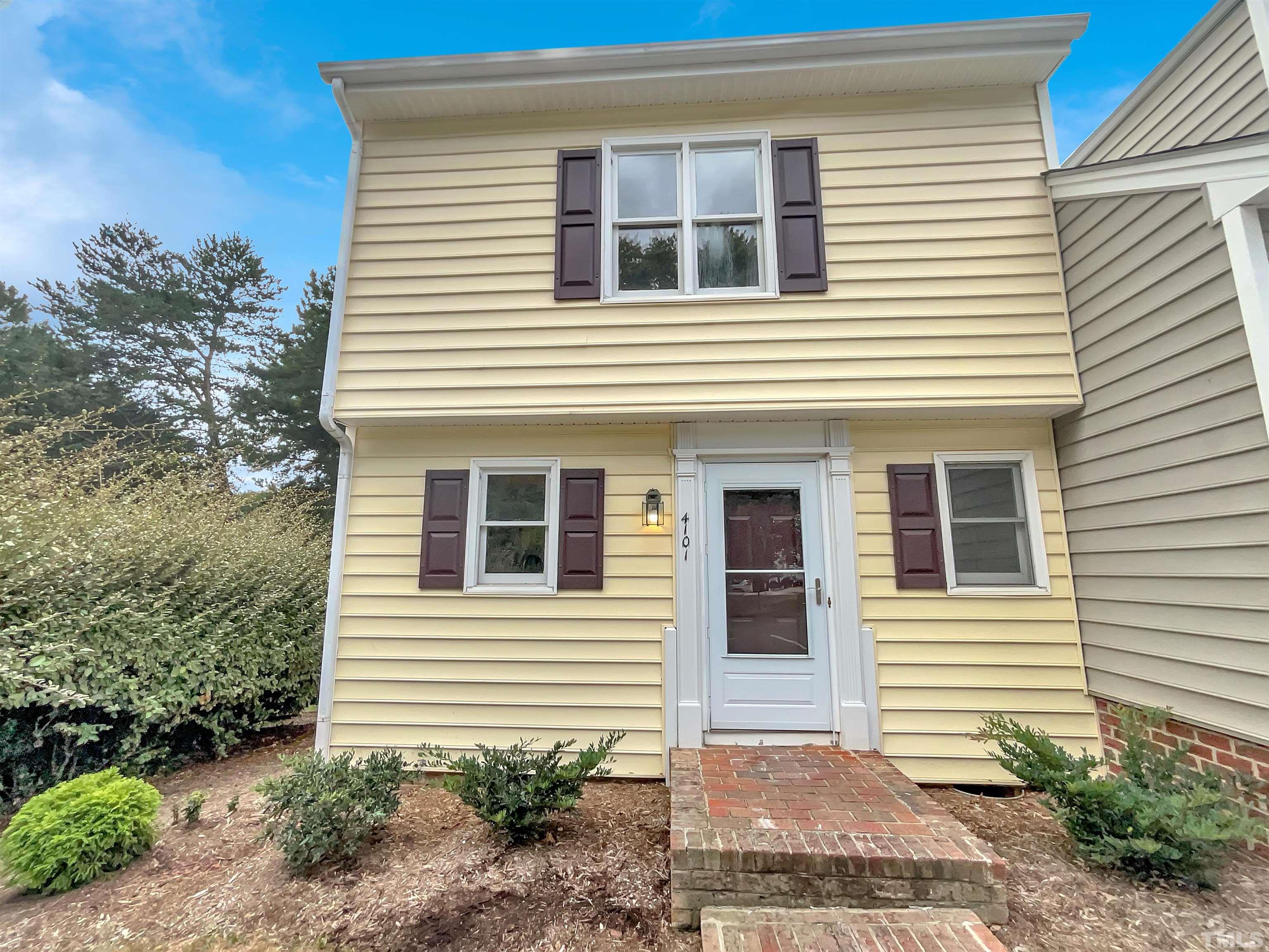 4101 Kaplan Drive Raleigh, NC 27606 - Photo 1 of 22 a view of a house with more windows and plants