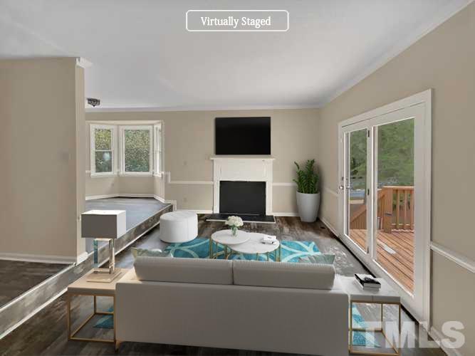 4101 Kaplan Drive Raleigh, NC 27606 - Photo 2 of 22 a living room with furniture and a flat screen tv