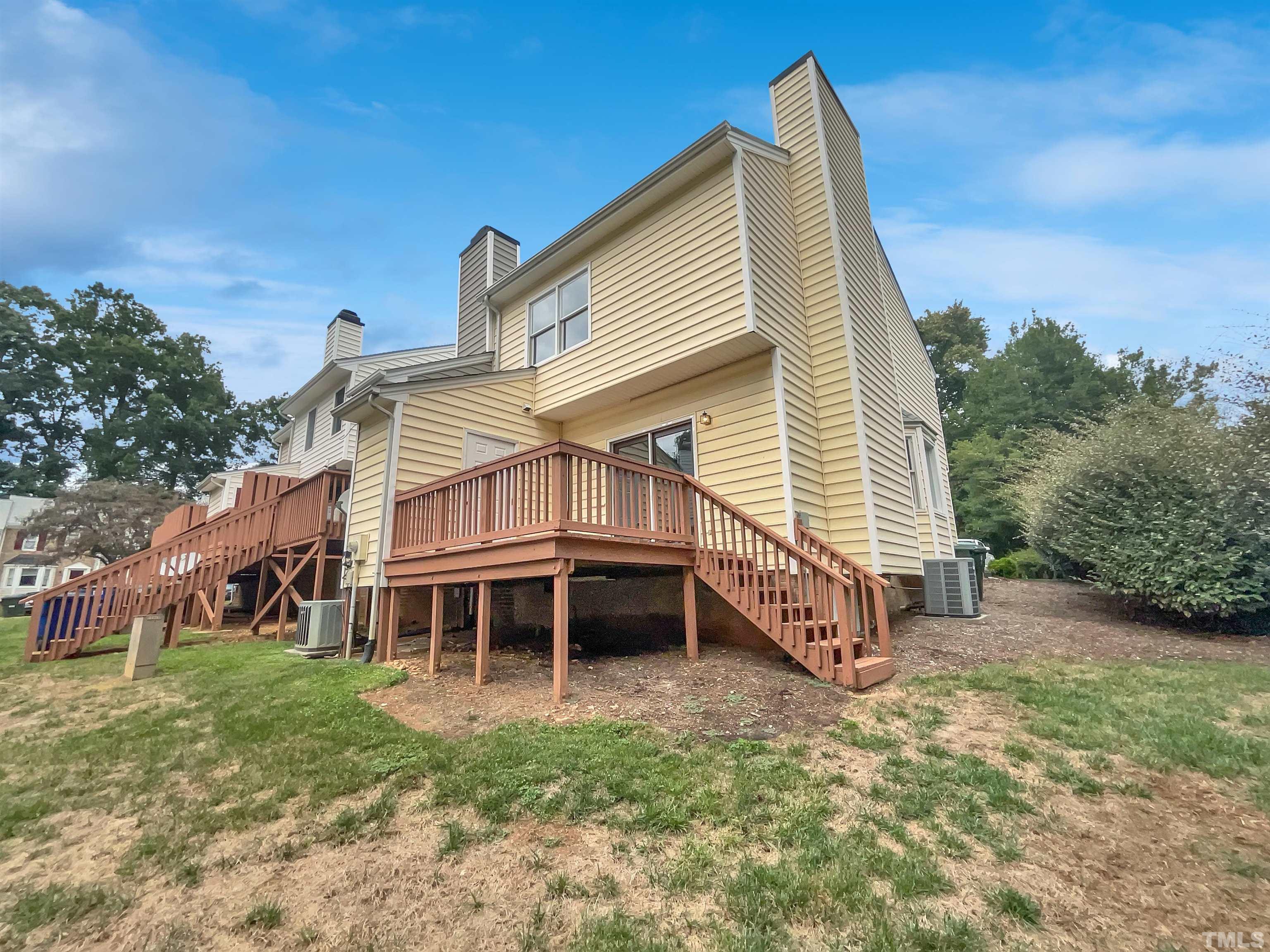 4101 Kaplan Drive Raleigh, NC 27606 - Photo 7 of 22 a view of a house with a yard
