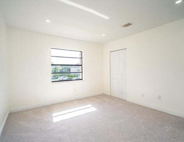 9284 Vista Del Lago, Unit 34F Boca Raton, FL 33428 - Photo 13 of 15 an empty room with windows
