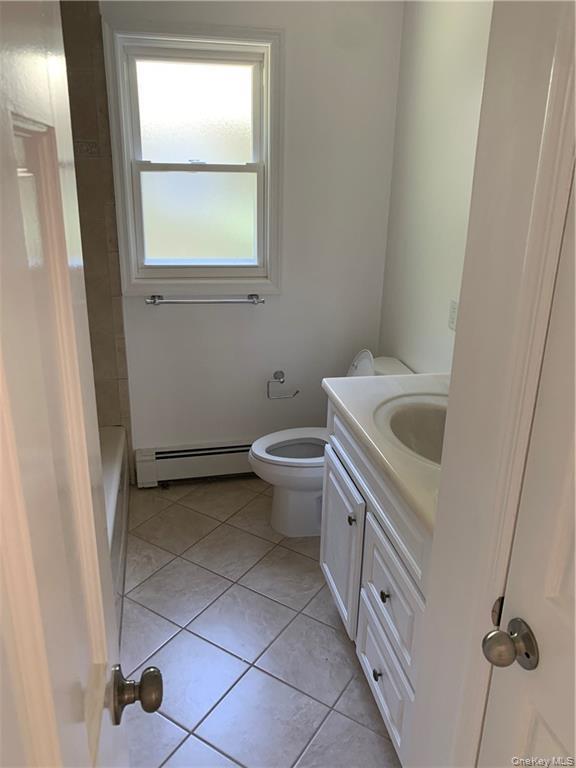 5 Ridge Road, Unit 2 Dobbs Ferry, NY 10522 - Photo 13 of 18 a bathroom with a sink toilet and window