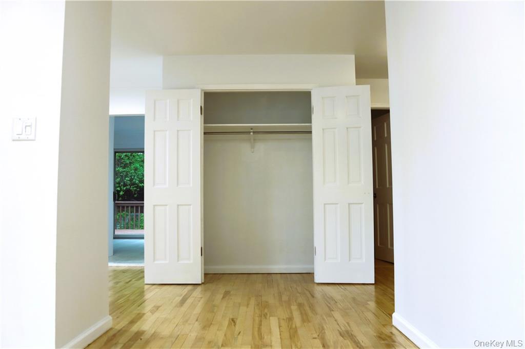 5 Ridge Road, Unit 2 Dobbs Ferry, NY 10522 - Photo 16 of 18 a view of an empty room with wooden floor and closet