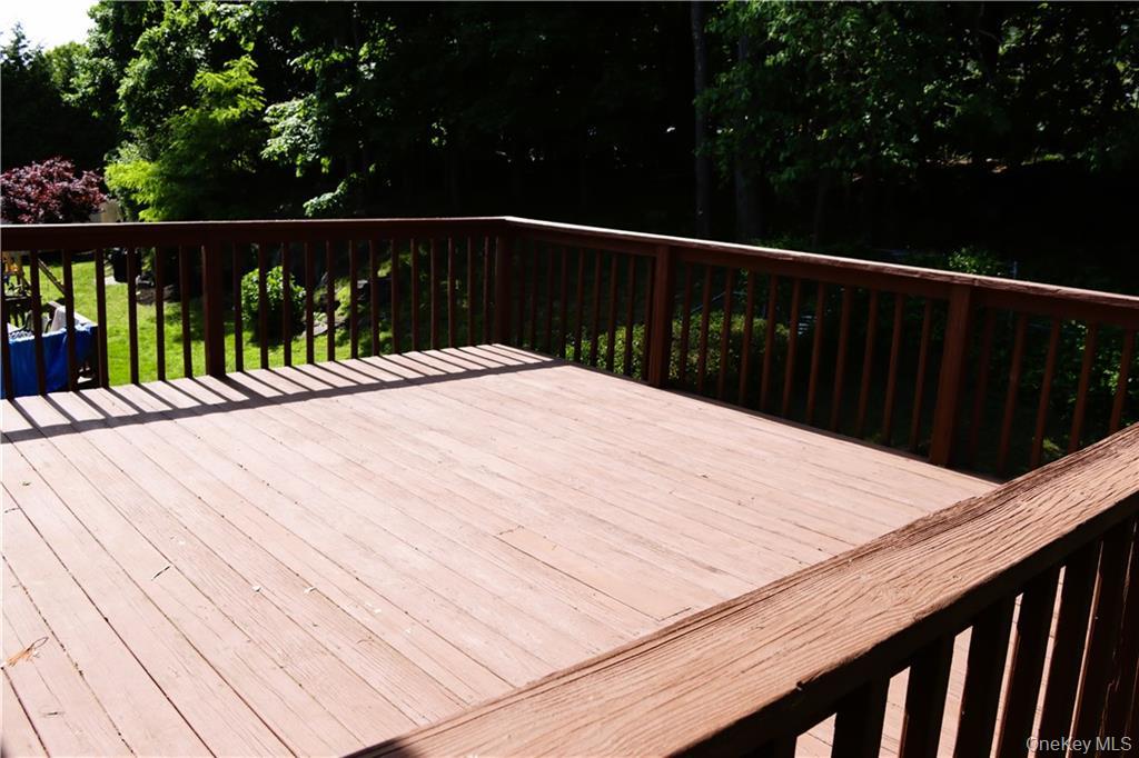 5 Ridge Road, Unit 2 Dobbs Ferry, NY 10522 - Photo 18 of 18 a wooden deck with a yard