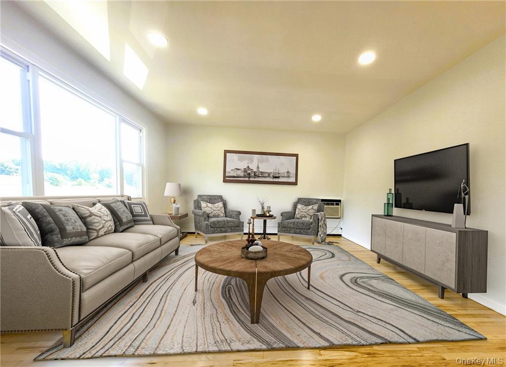 5 Ridge Road, Unit 2 Dobbs Ferry, NY 10522 - Photo 4 of 18 a living room with furniture and a flat screen tv