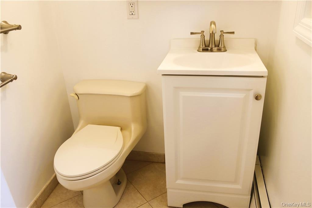 5 Ridge Road, Unit 2 Dobbs Ferry, NY 10522 - Photo 9 of 18 a bathroom with a toilet and a sink
