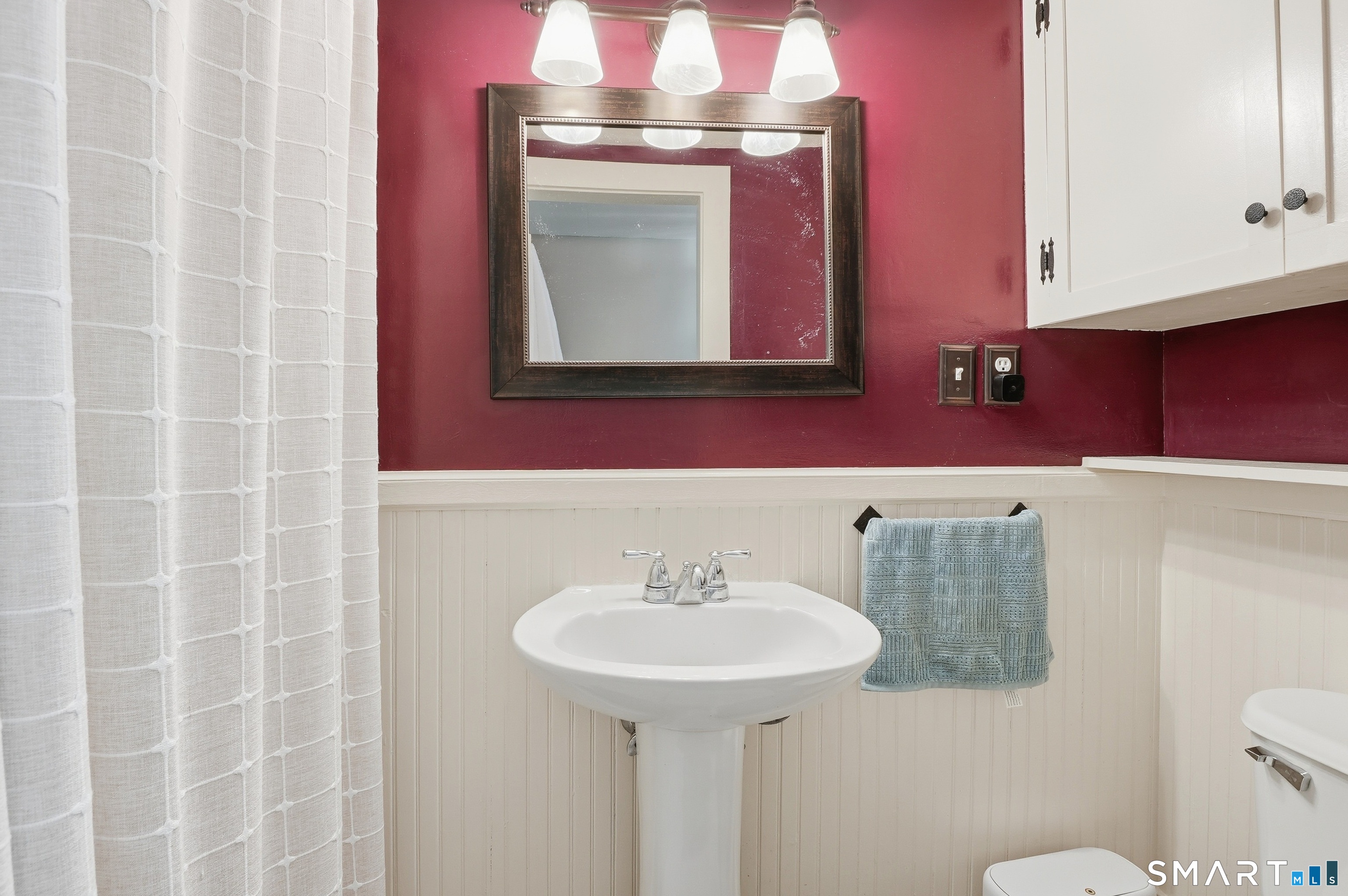 417 Washington Street Norwich, CT 06360 - Photo 21 of 40 a bathroom with a sink and a mirror