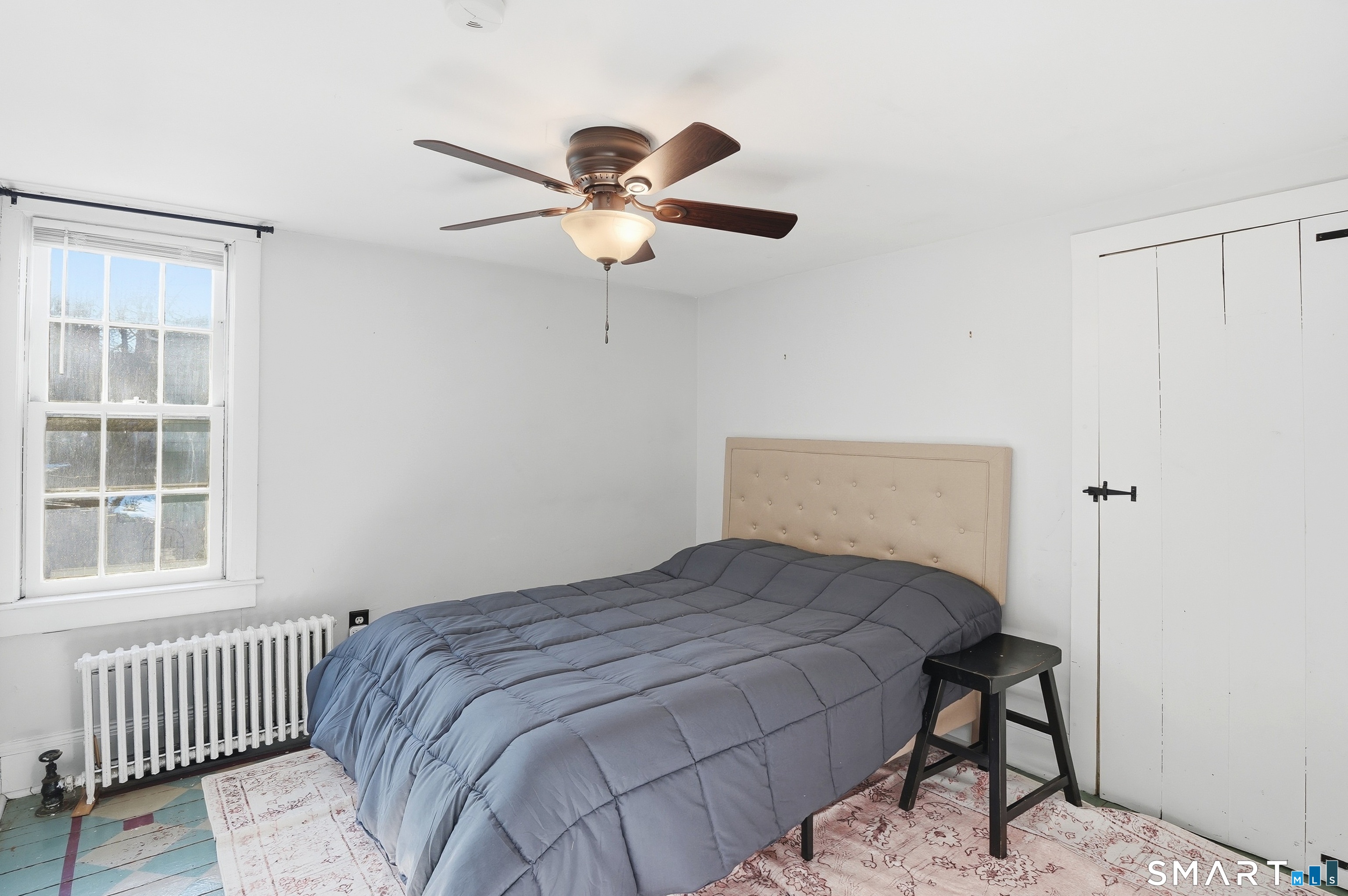 417 Washington Street Norwich, CT 06360 - Photo 24 of 40 a bedroom with a bed and a window