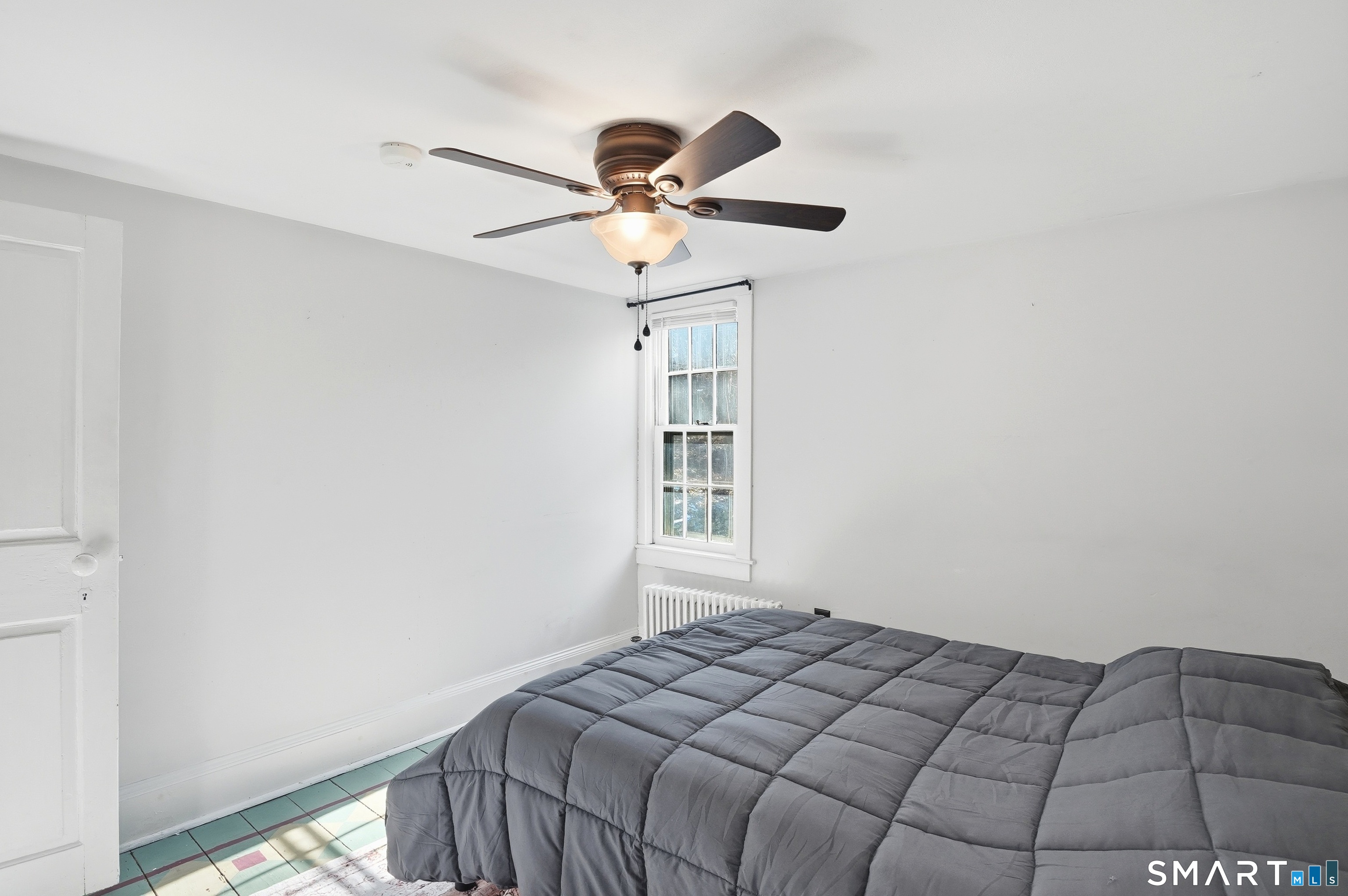 417 Washington Street Norwich, CT 06360 - Photo 25 of 40 a bedroom with a bed and a window