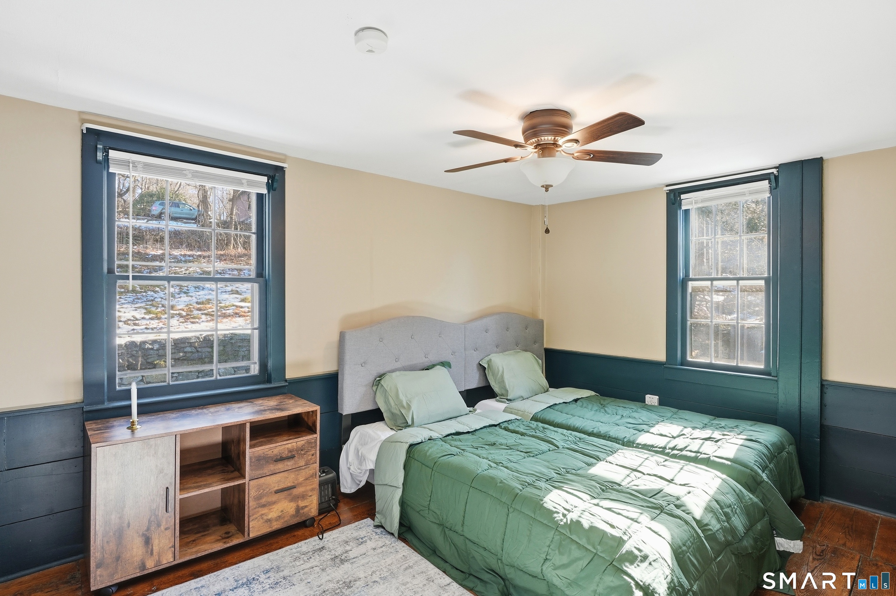 417 Washington Street Norwich, CT 06360 - Photo 26 of 40 a bedroom with a bed and a chandelier