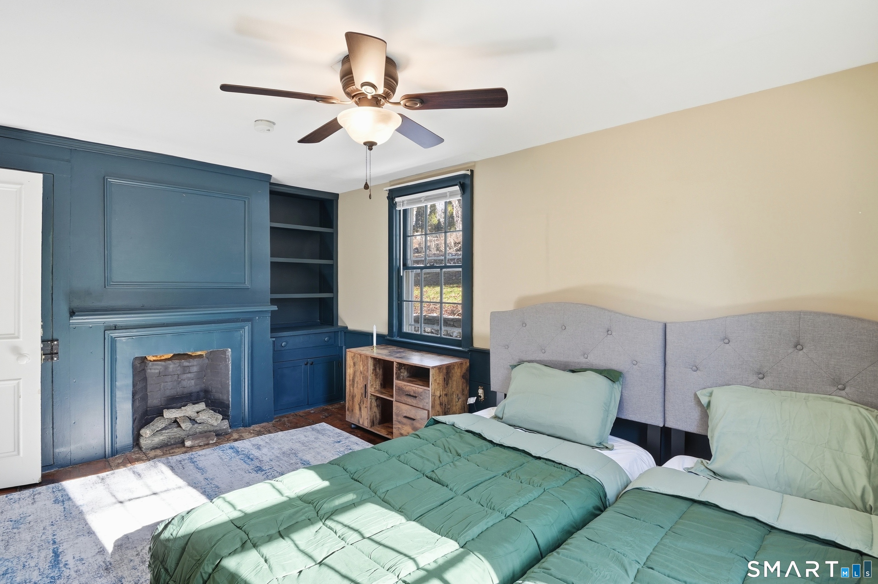 417 Washington Street Norwich, CT 06360 - Photo 27 of 40 a bedroom with a bed and a chandelier