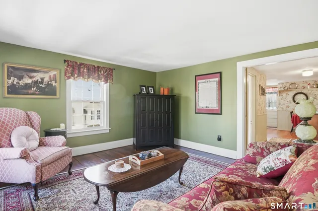 a living room with furniture and a table