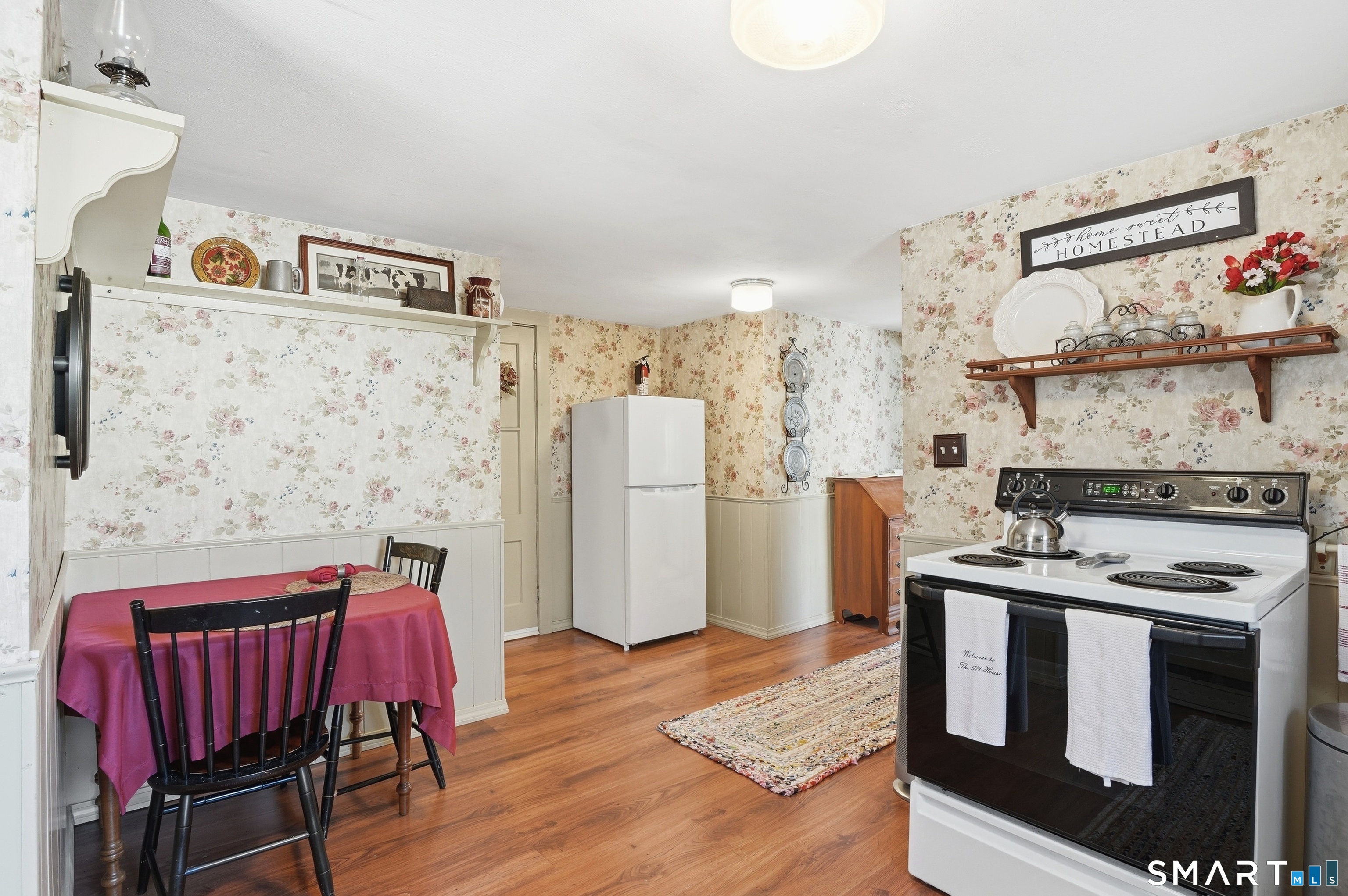 417 Washington Street Norwich, CT 06360 - Photo 34 of 40 a kitchen with stainless steel appliances granite countertop a stove a refrigerator and a dining table