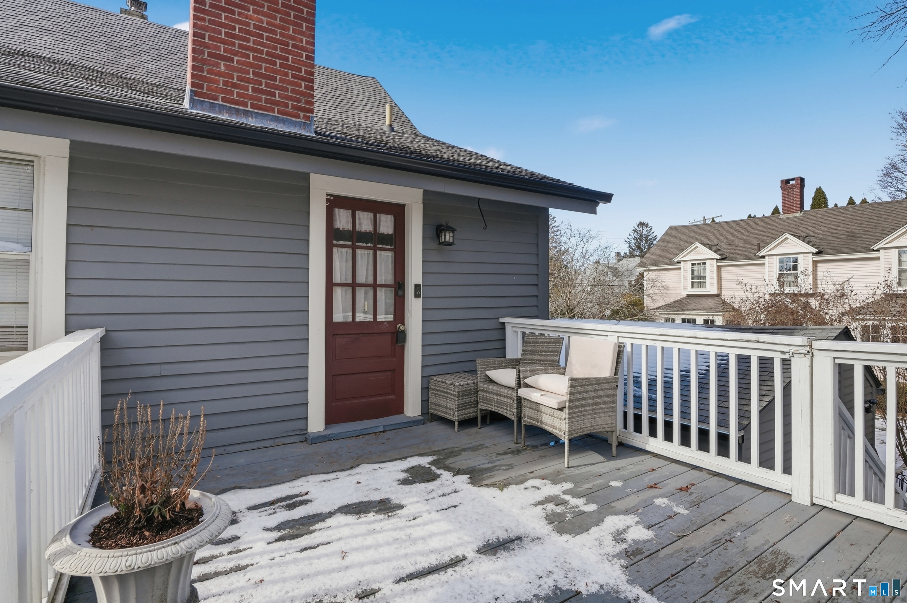 417 Washington Street Norwich, CT 06360 - Photo 37 of 40 a view of a patio with a table and chairs and a barbeque