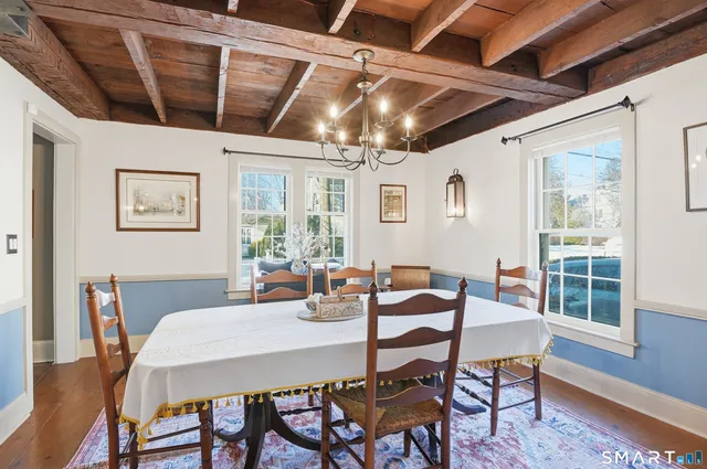 a dining room with furniture and window
