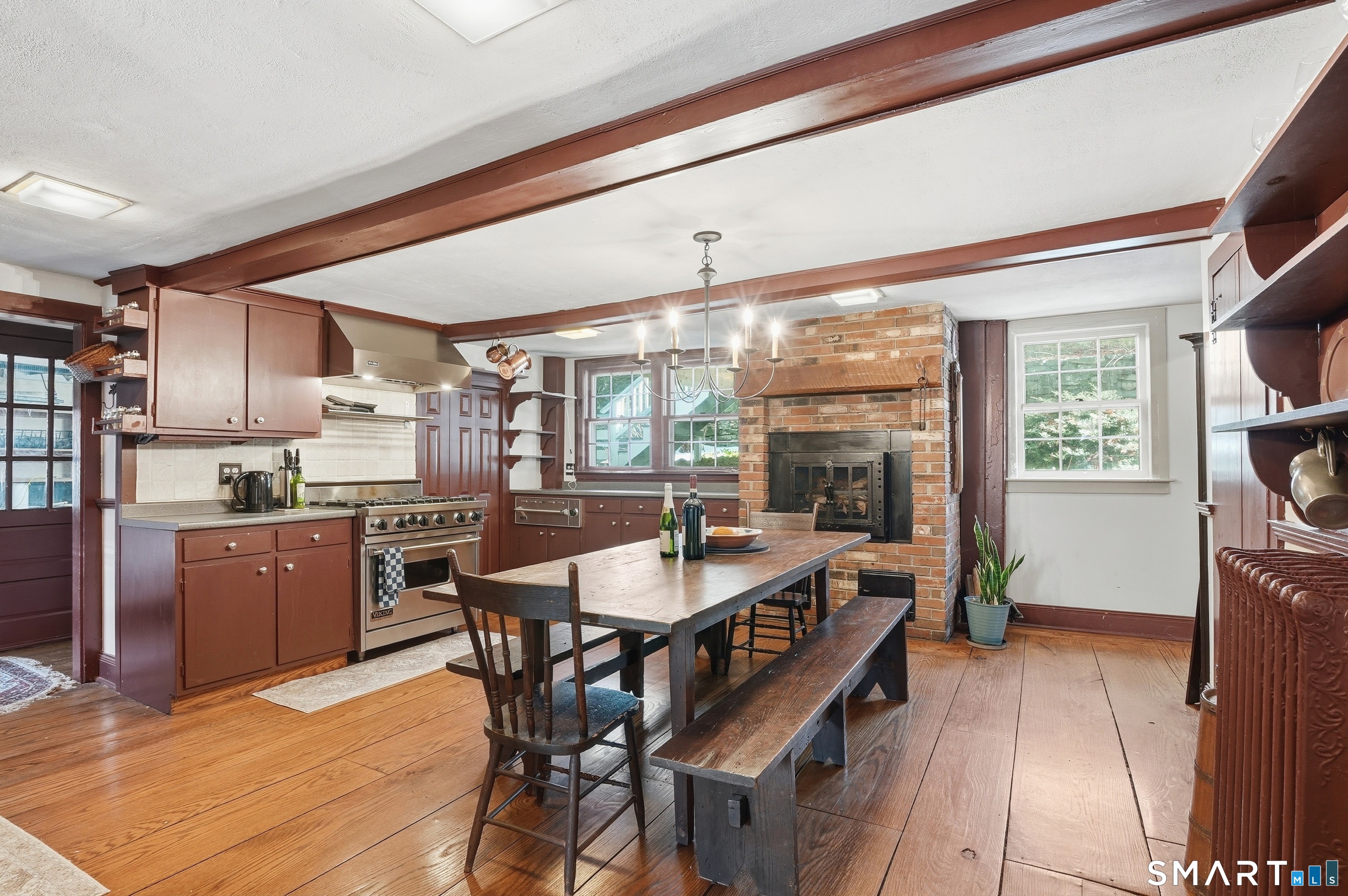 417 Washington Street Norwich, CT 06360 - Photo 9 of 40 a dining room with stainless steel appliances granite countertop a kitchen island a stove a refrigerator and a dining table with kitchen view