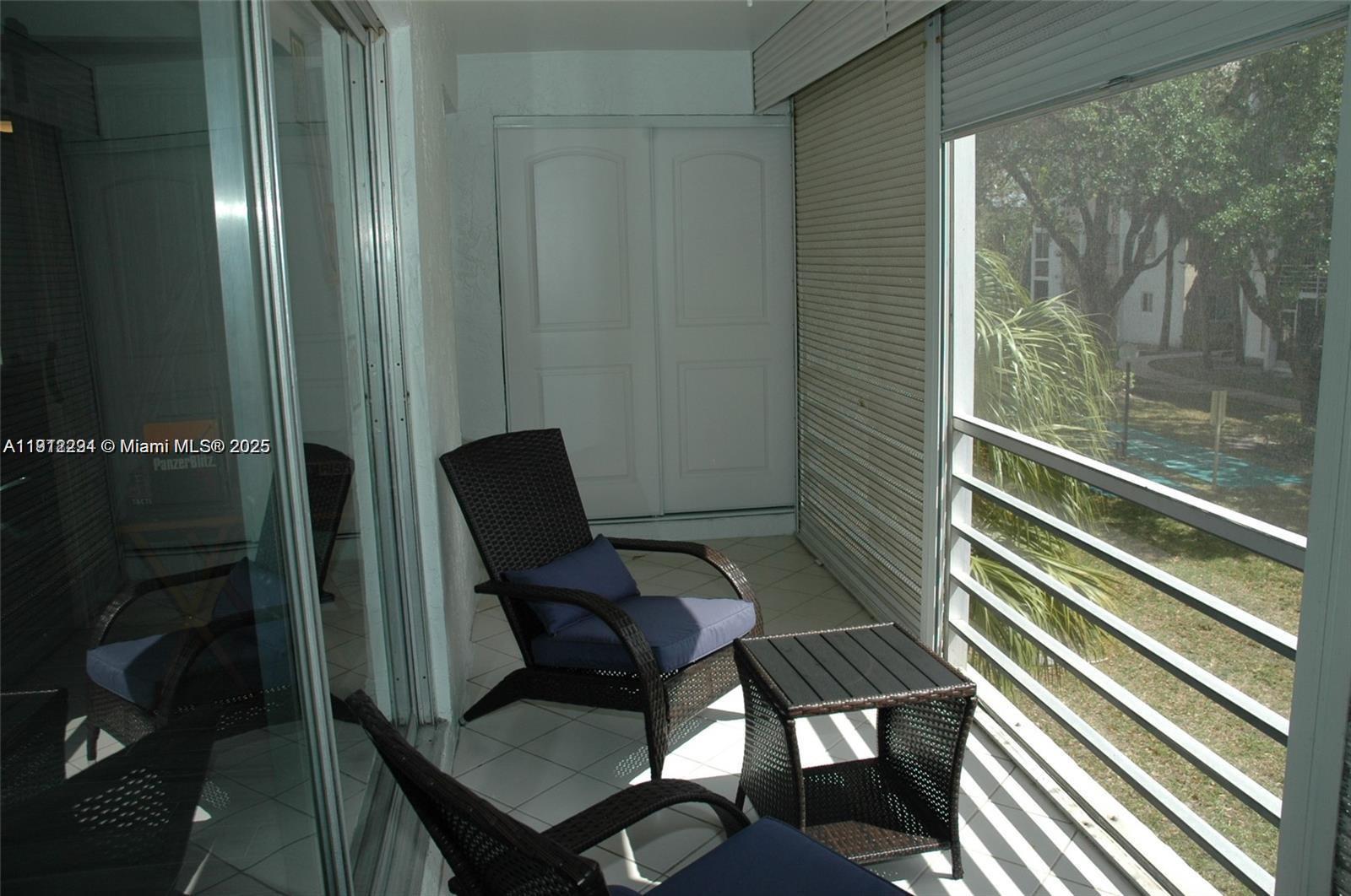 3571 Inverrary Drive, Unit 201 Lauderhill, FL 33319 - Photo 13 of 48 a view of a balcony with furniture and next to a window