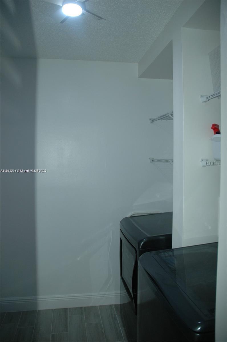 3571 Inverrary Drive, Unit 201 Lauderhill, FL 33319 - Photo 17 of 48 a utility room with dryer and washer