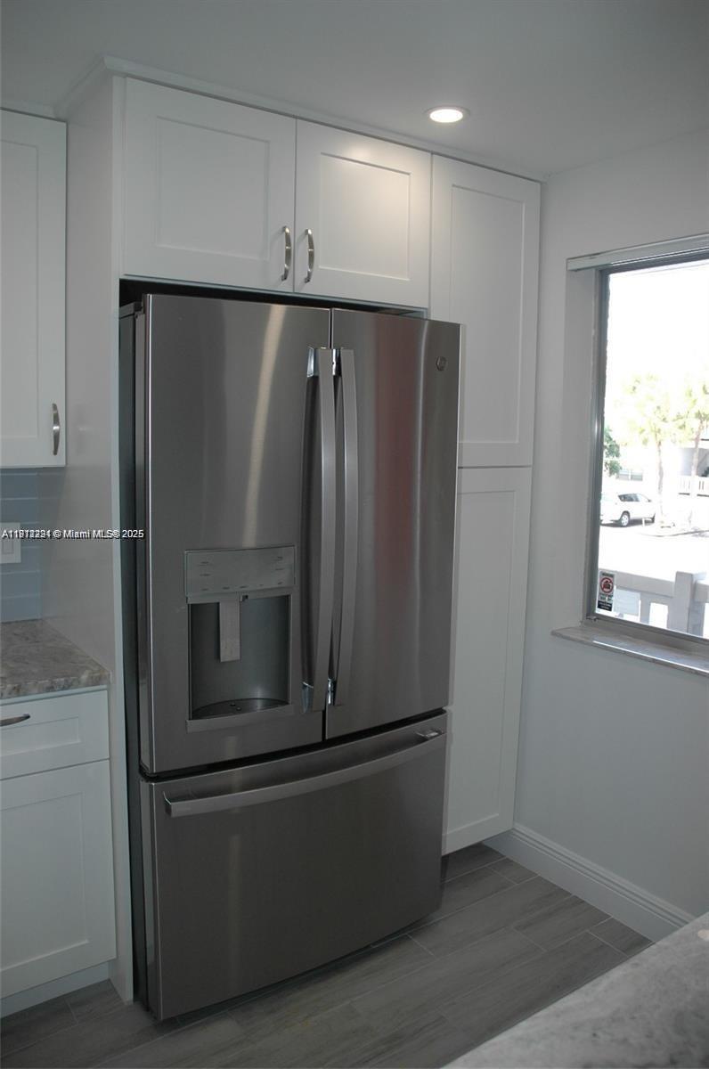 3571 Inverrary Drive, Unit 201 Lauderhill, FL 33319 - Photo 28 of 48 a room with wooden floor and window