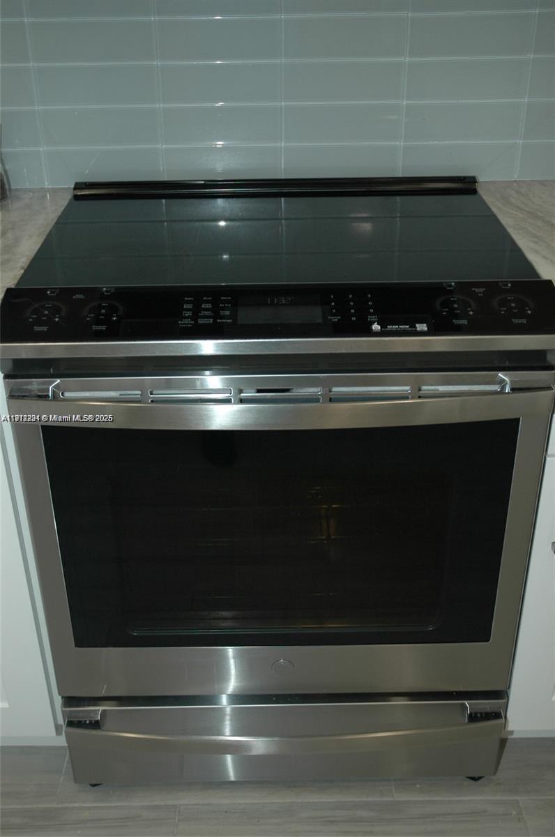 3571 Inverrary Drive, Unit 201 Lauderhill, FL 33319 - Photo 30 of 48 a stove top oven sitting inside of a kitchen