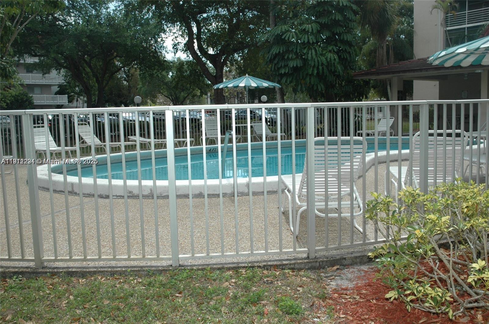 3571 Inverrary Drive, Unit 201 Lauderhill, FL 33319 - Photo 39 of 48 a view of outdoor space with deck and yard