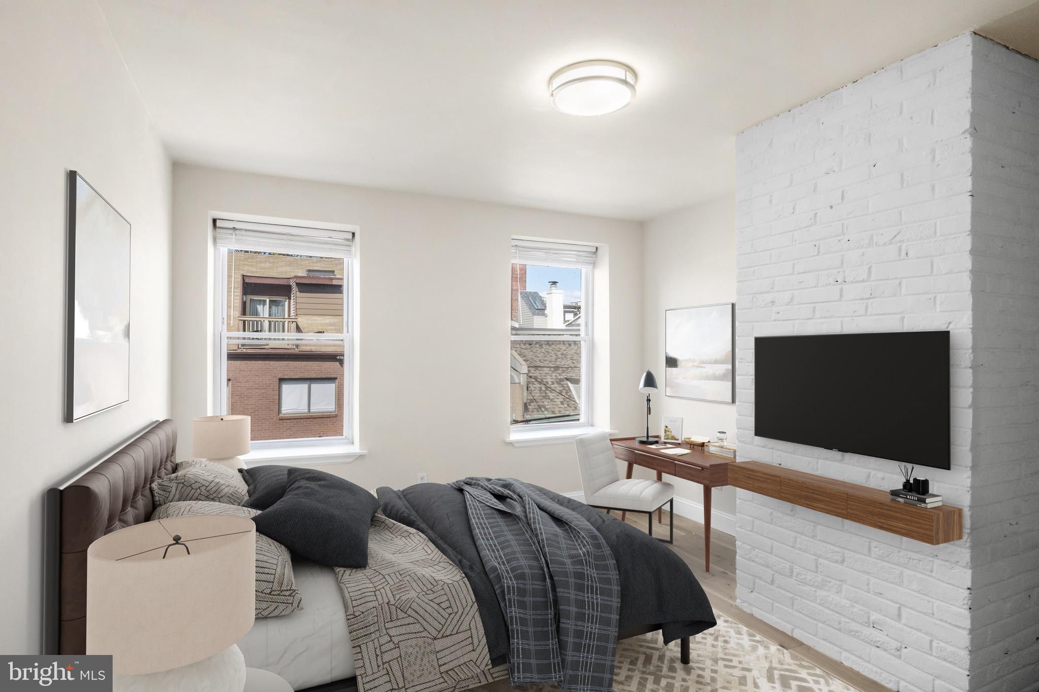 234 Bainbridge Street, Unit 2F Philadelphia, PA 19147 - Photo 4 of 10 a living room with furniture and a flat screen tv