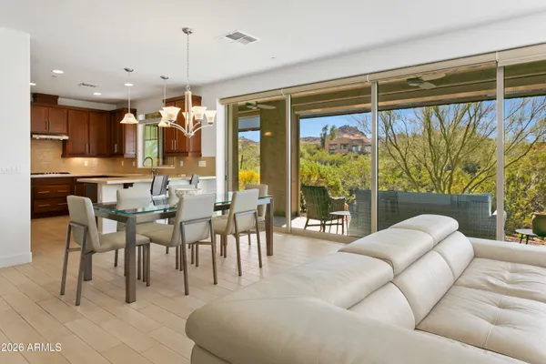 a living room with a large window and a table